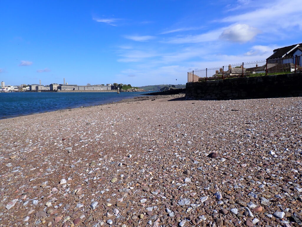 The sloping stony beach at Cremyl
